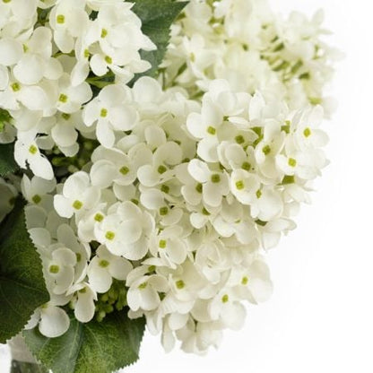 Artificial white hydrangea flower bouquet in a vase