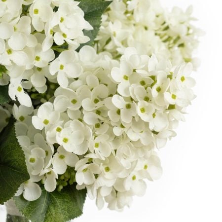 Artificial white hydrangea flower bouquet in a vase